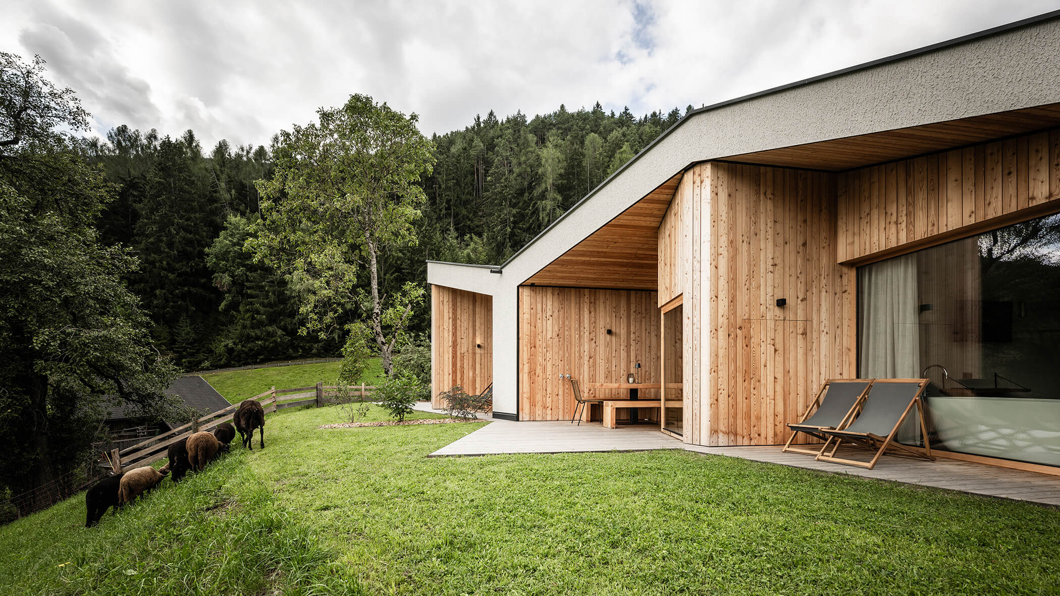 The chalet terraces with sun loungers, sauna and seating - Oberplunerhof